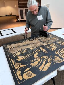 Tony working on a large format relief print